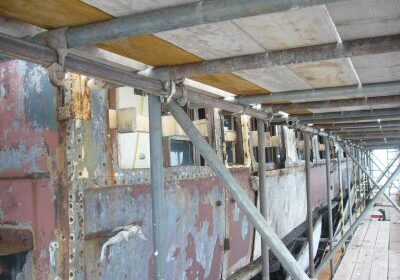 The protective plywood panels have been removed from Heritage Carriages Project coach no 6705 now under cover at Crewe on 4 August 2009. Picture by Walt Denning.